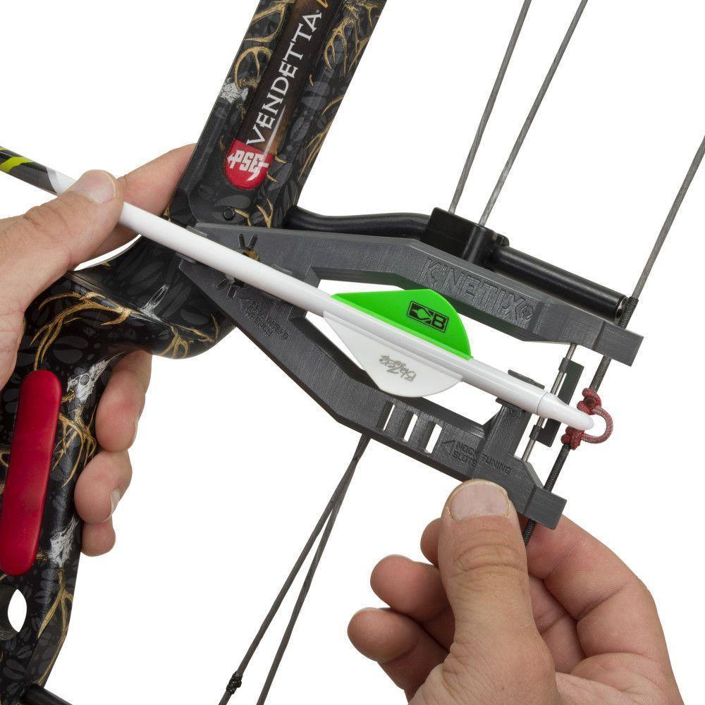 Hands using K-NETIX archery bow square multitool to align arrow on compound bow