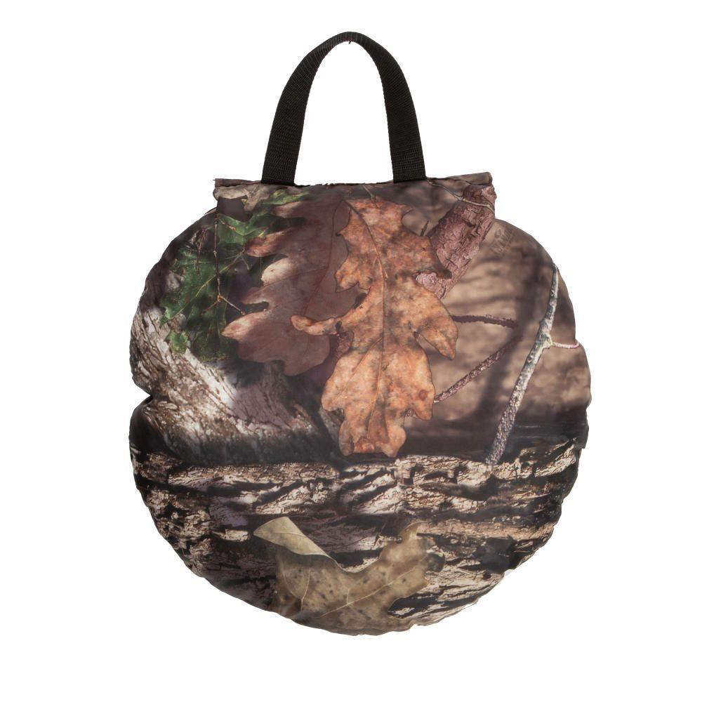 Camo hunting seat cushion with fall leaf and bark print, black carrying handle on top