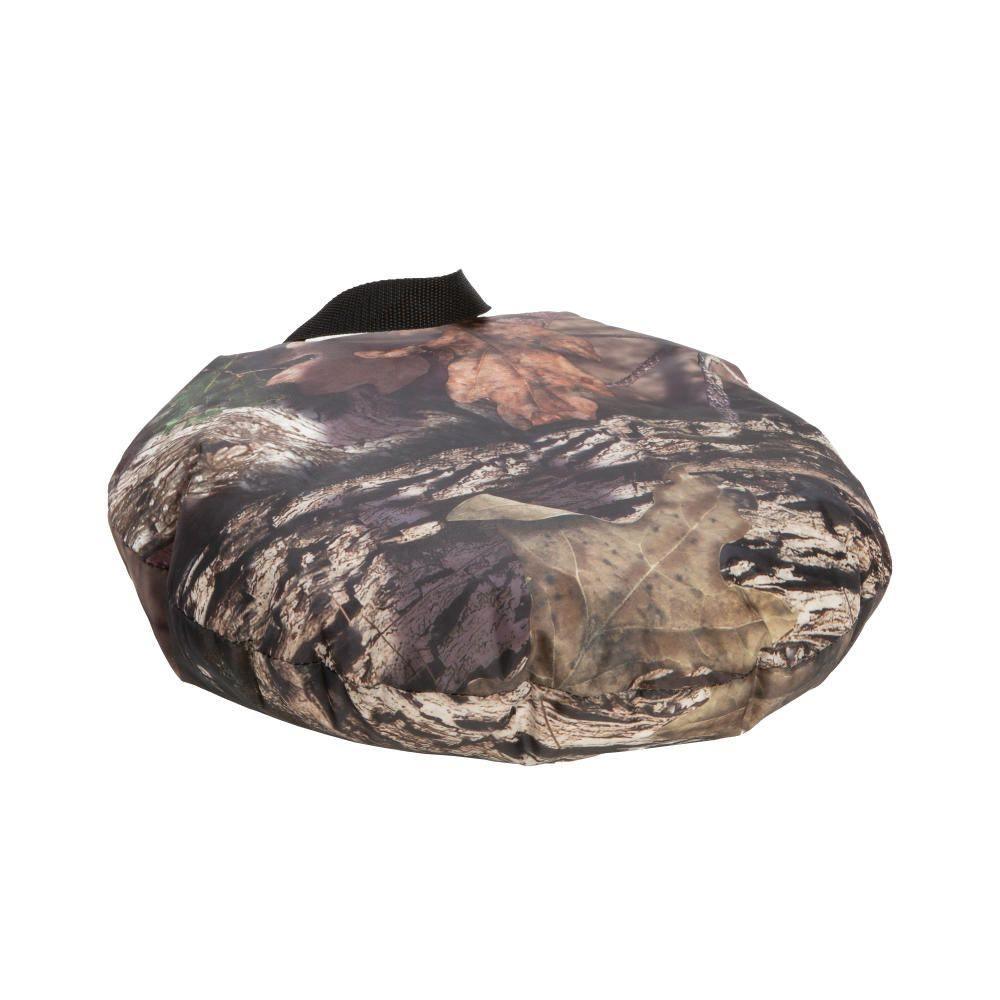 Camo hunting seat cushion with leaf and bark pattern and black carrying strap