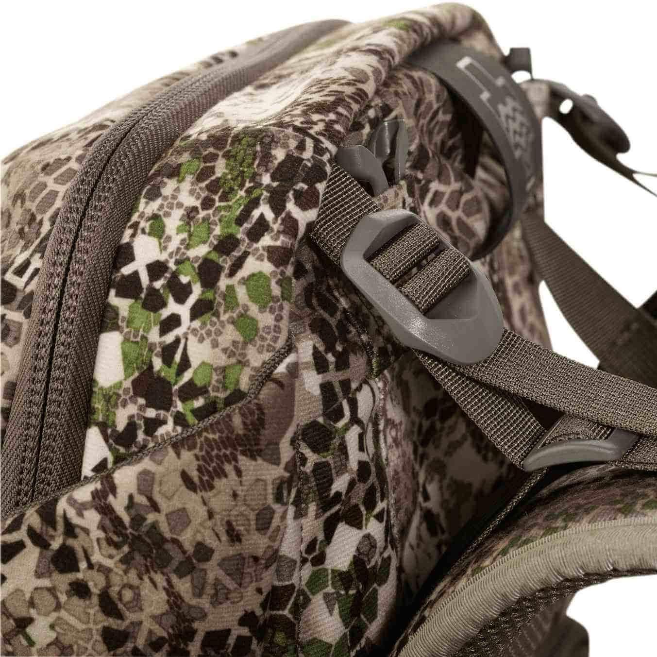 Close-up of camouflage hunting backpack with strap and zipper details, outdoor gear