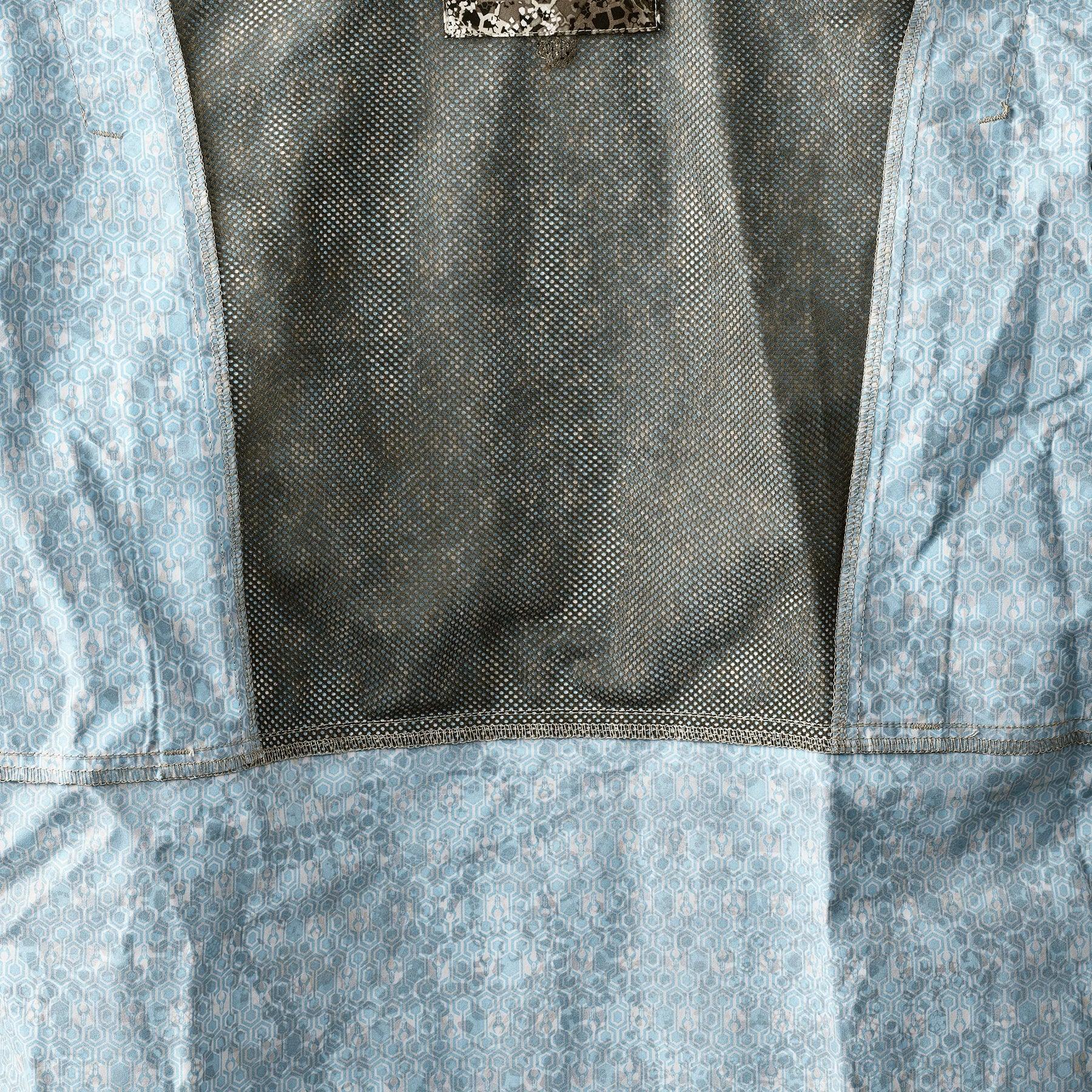 Close-up of Badlands Algus button down shirt inner mesh and blue patterned fabric