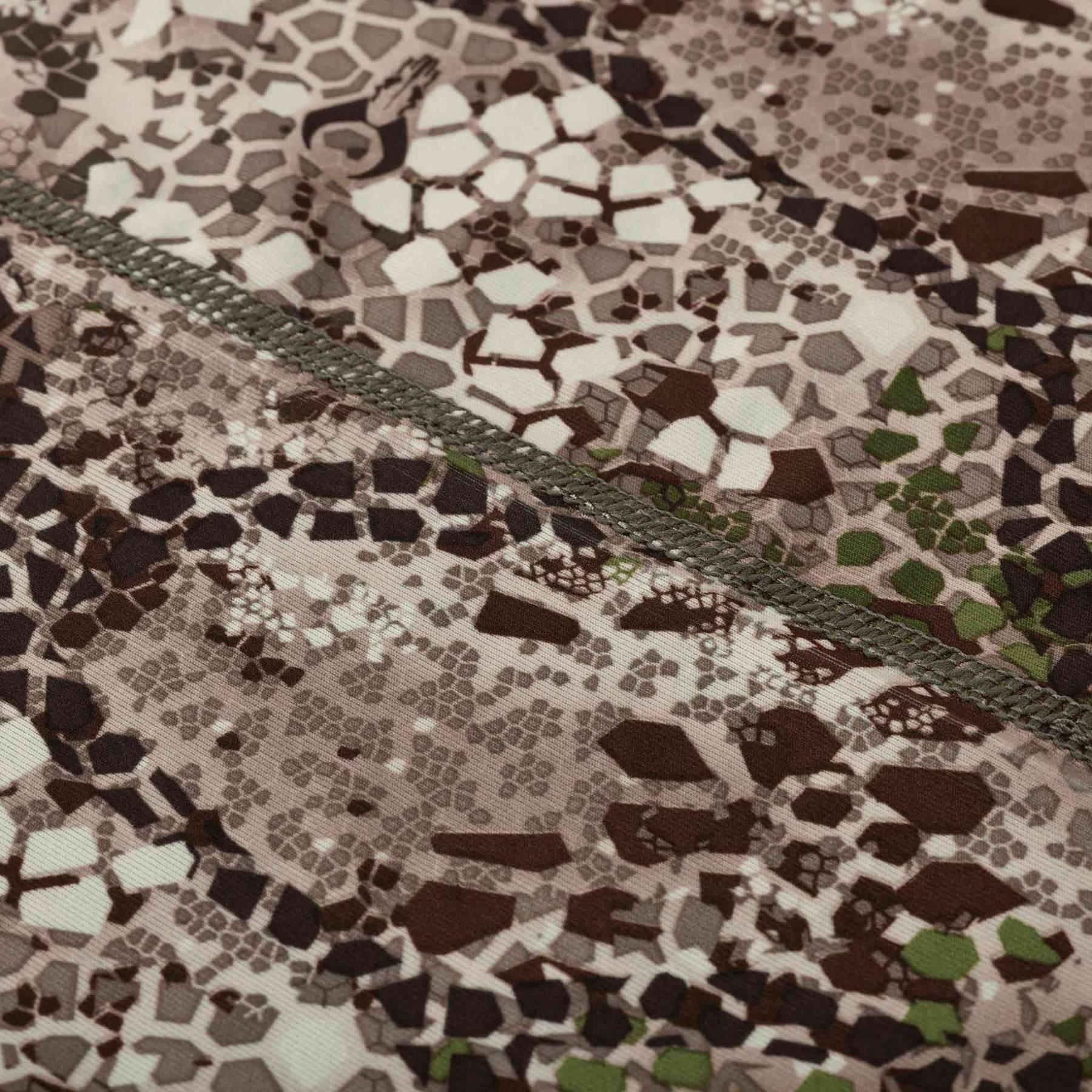 Close-up of Badlands Algus Neck Gaiter with brown camo pattern and stitched seam