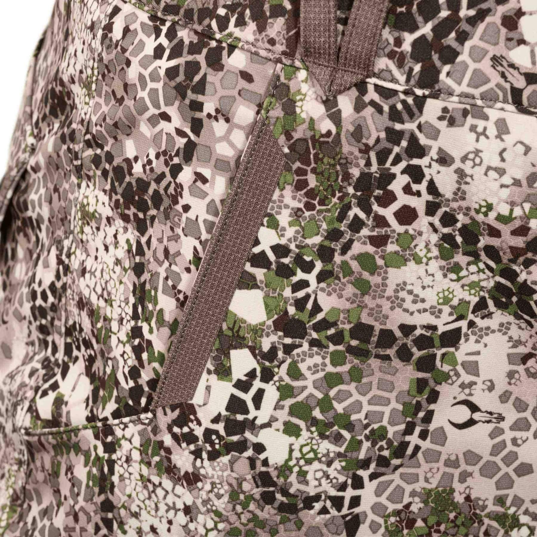 Close-up of Badlands Algus Pant with green and brown camo pattern and side pocket detail