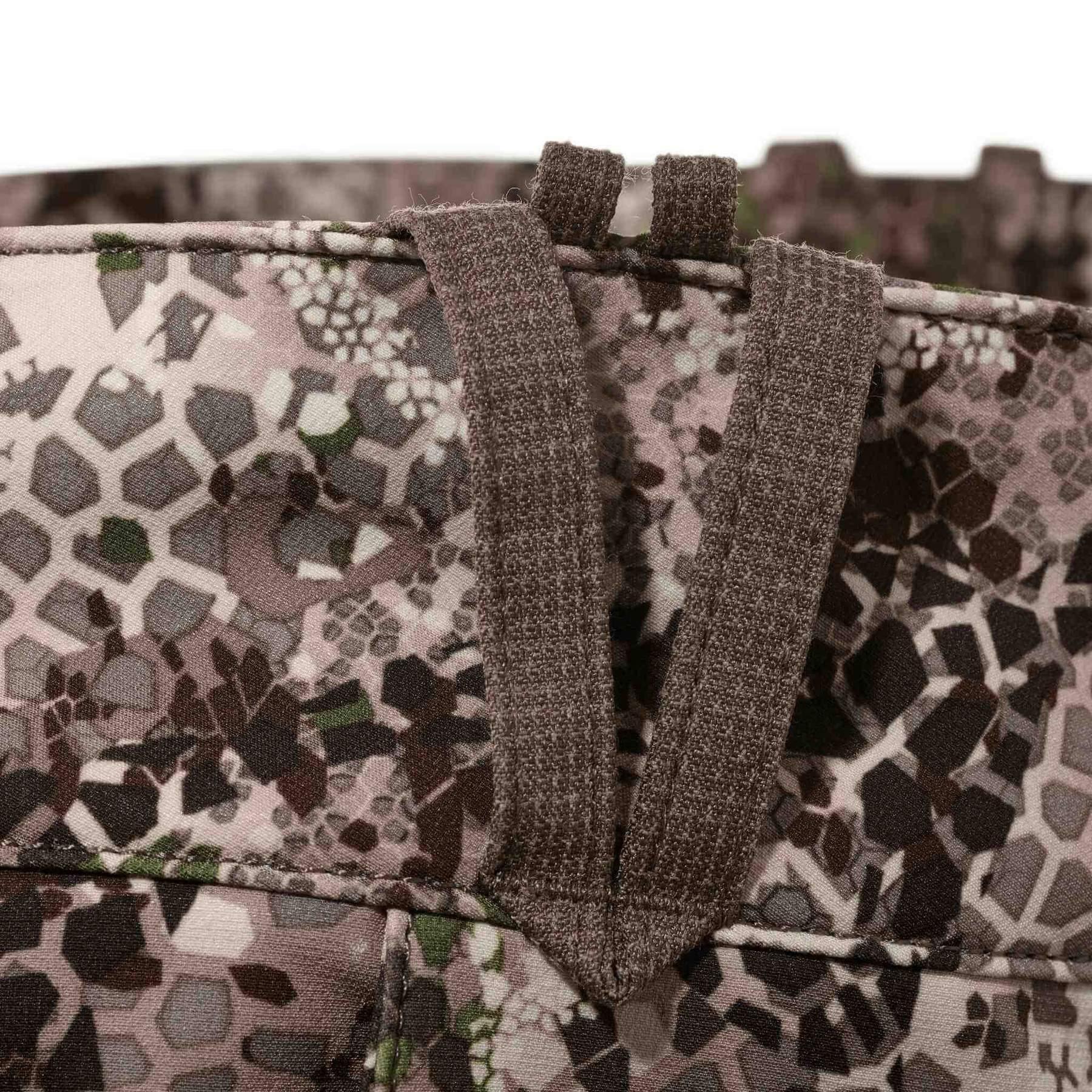 Close-up of Badlands Algus Pant belt loop with camo pattern fabric detail