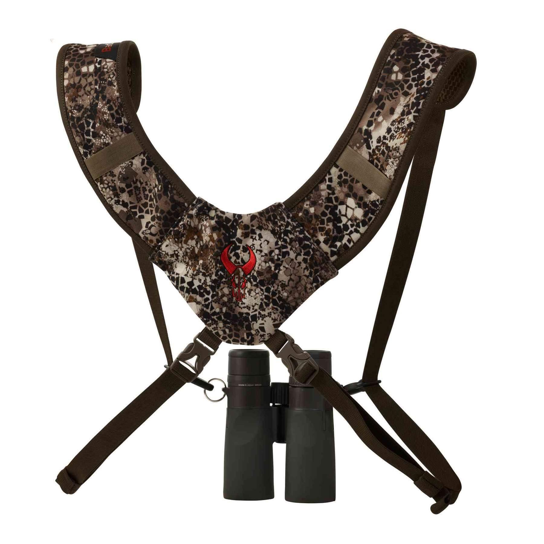 Badlands Bino Basics camo binocular harness straps with red skull logo and attached binoculars