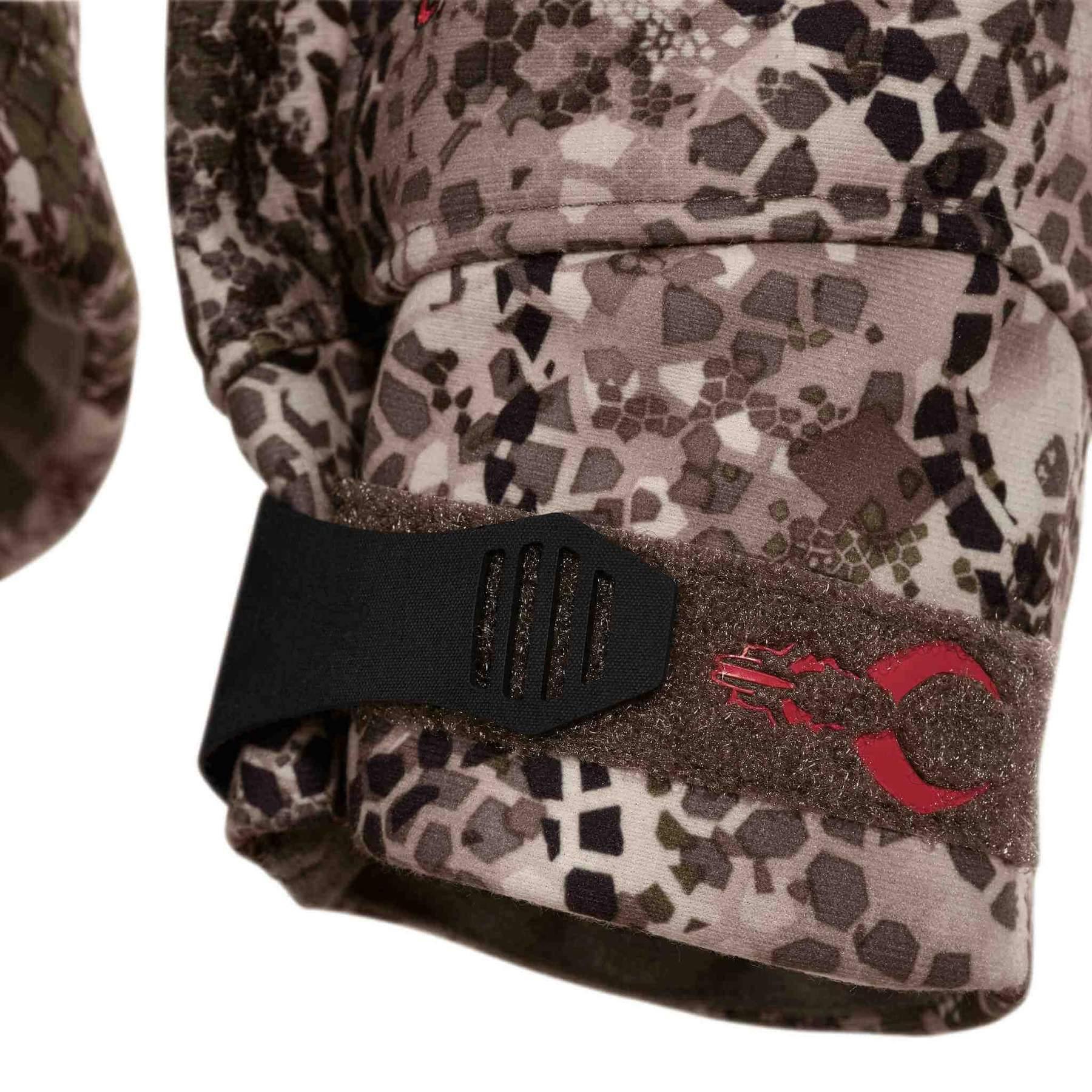 Badlands Calor camo jacket adjustable cuff with red logo, close-up view