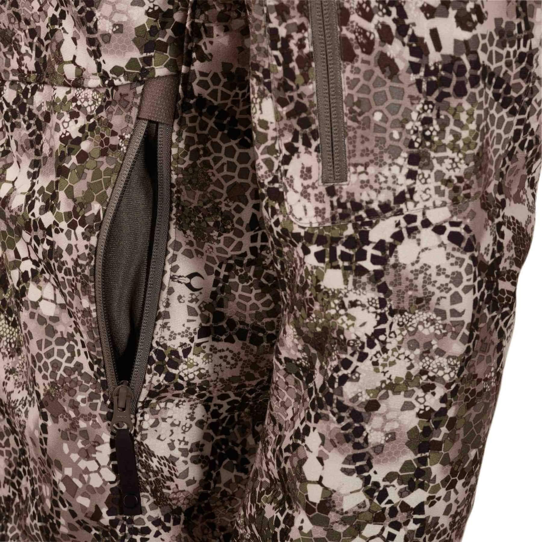 Close-up of Badlands Calor Jacket with camouflage pattern and zippered pocket