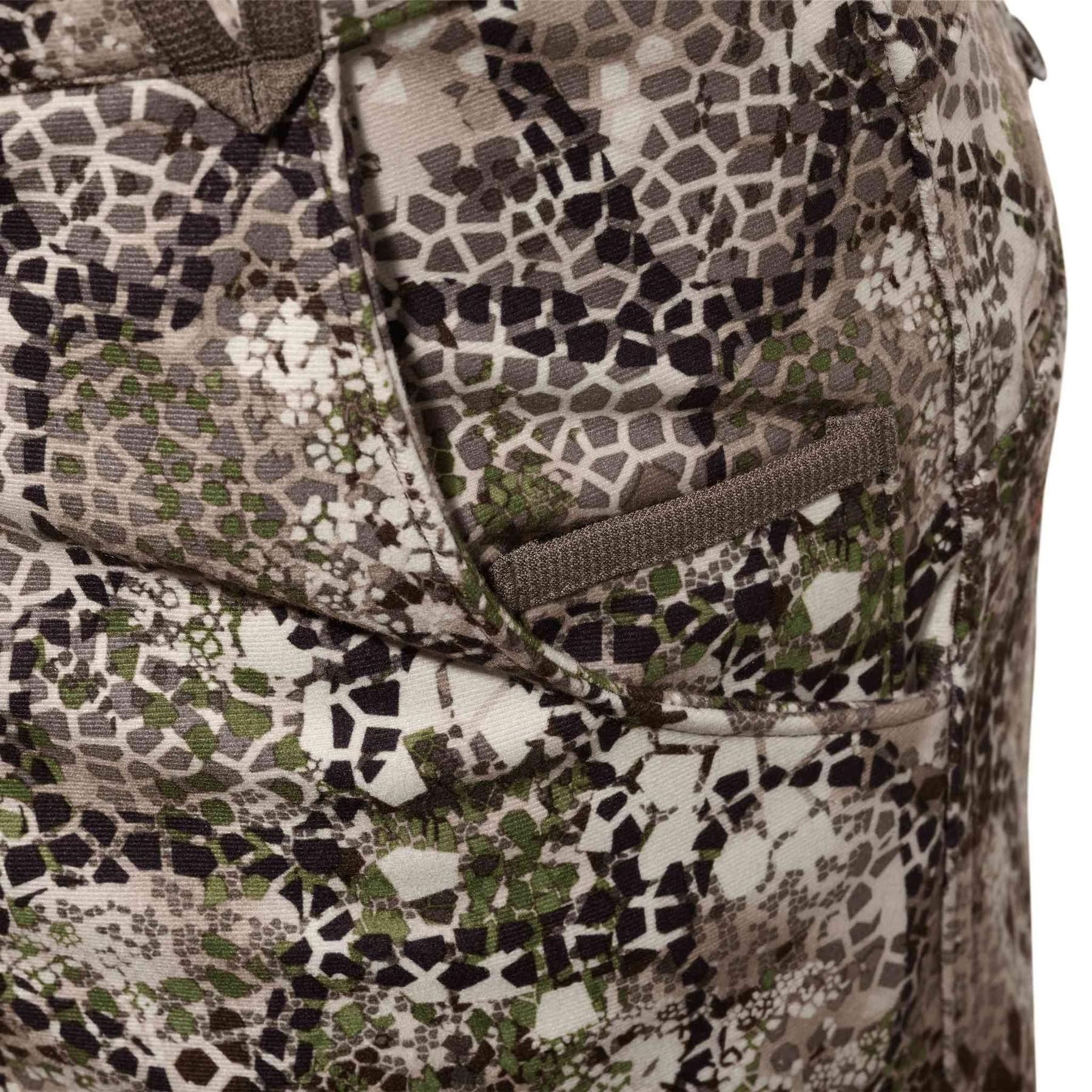 Close-up of Badlands Calor Pant with camo pattern and zip pocket detail