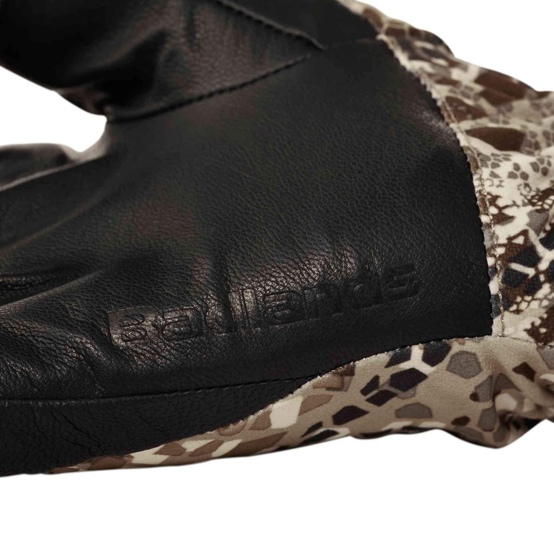 Badlands glove close-up with black leather and camo fabric detailing