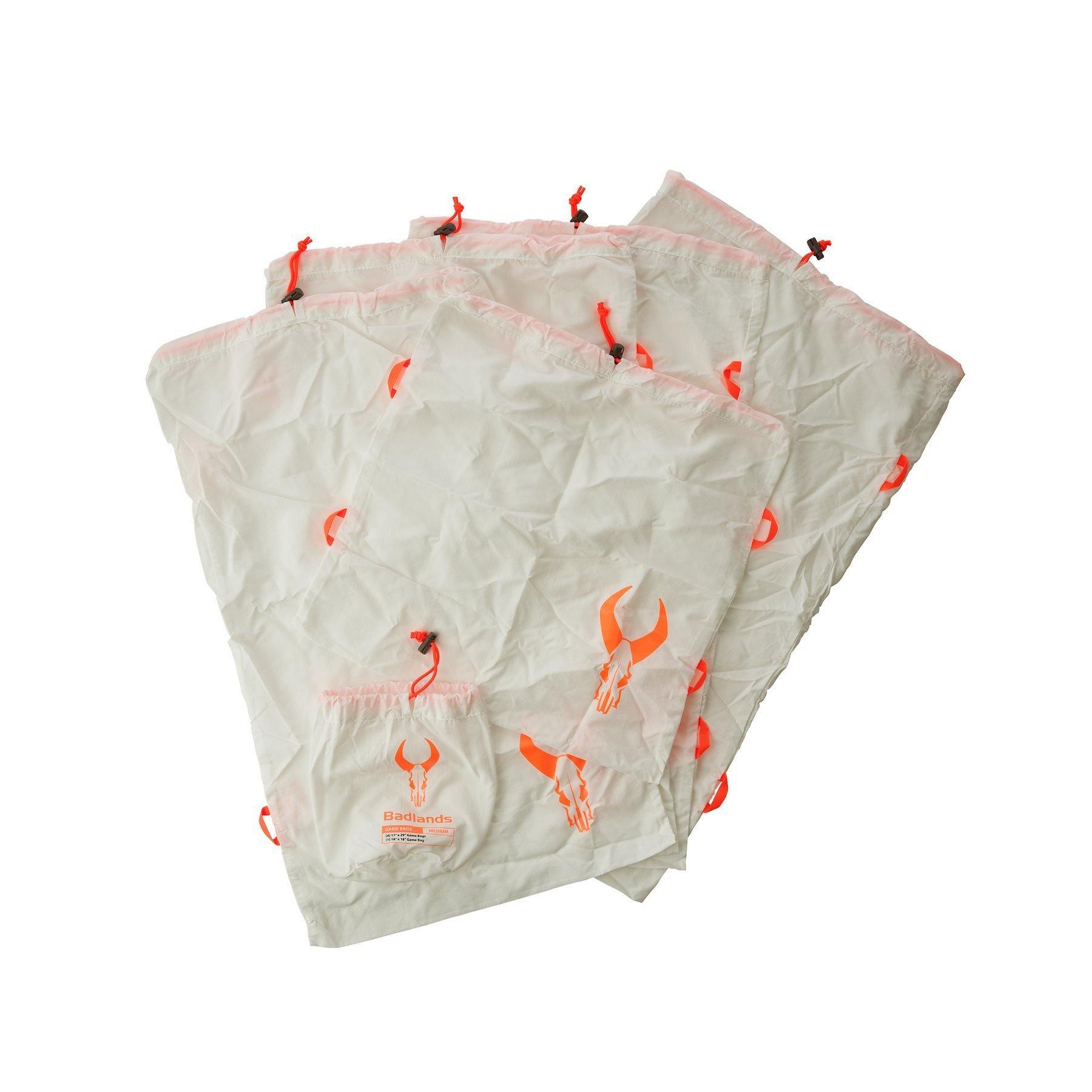 Badlands game bags set with orange skull logo and drawstrings on white background