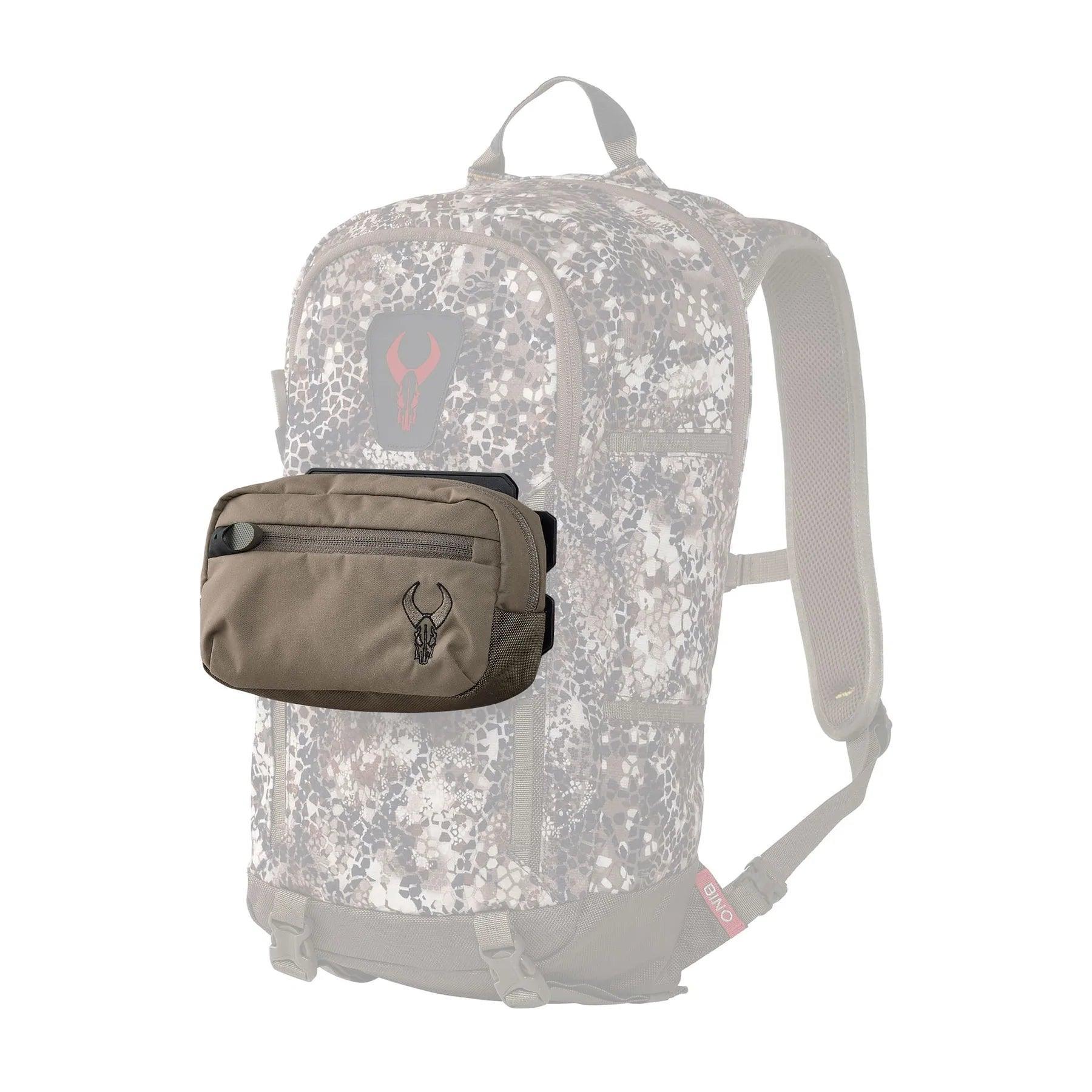 Badlands horizontal pocket in tan attached to camo hunting backpack