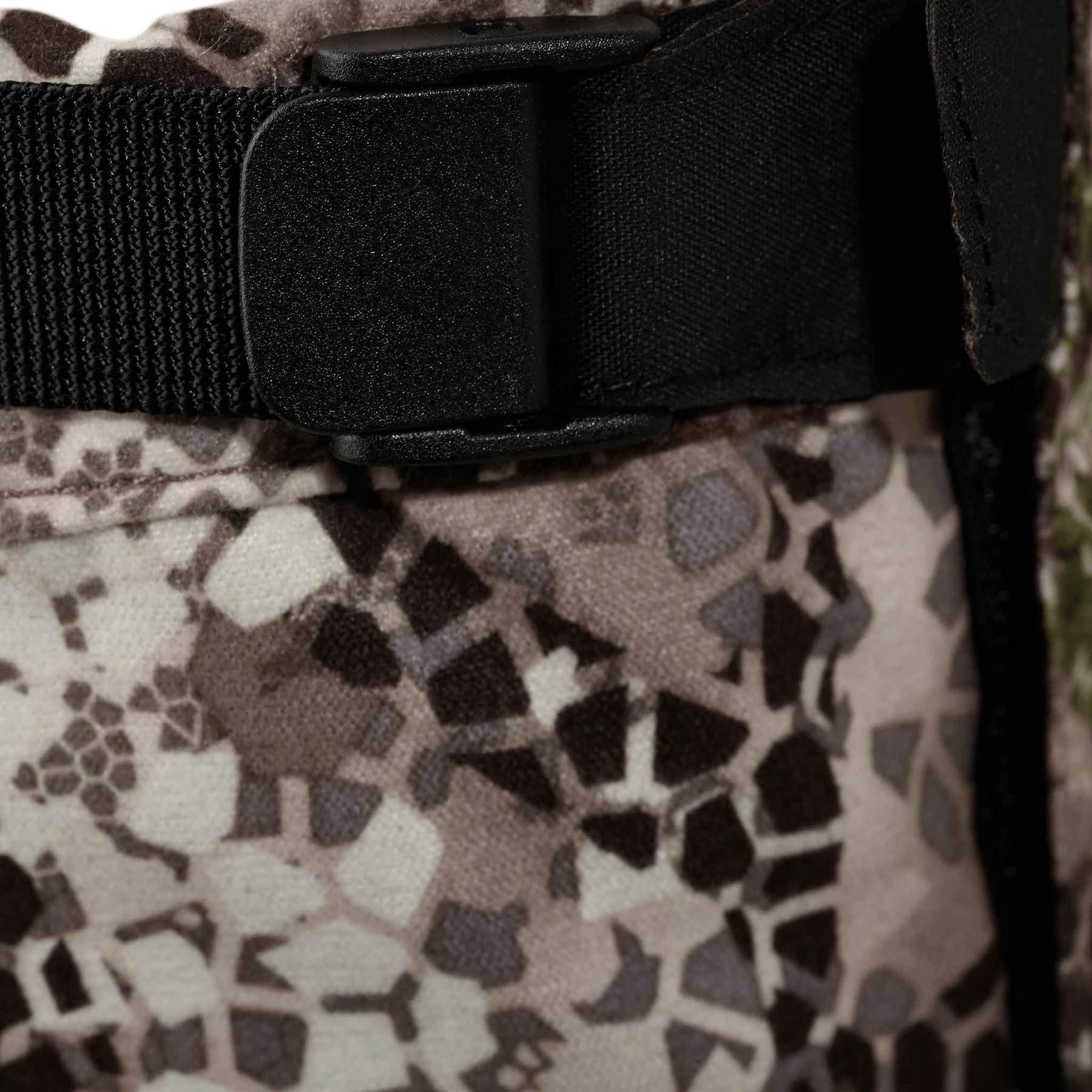 Close-up of camo fabric with black buckle, Badlands gaiter outdoor gear