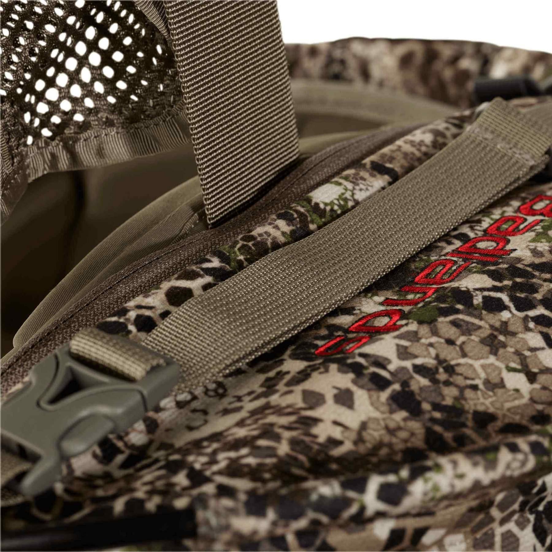 Close-up of Badlands camo fanny pack with mesh strap and red embroidered logo
