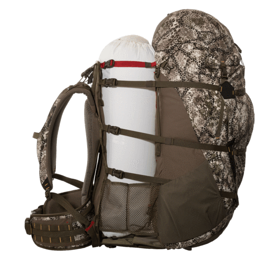 Badlands MRK 6 camo frame pack with large white gear bag strapped, outdoor backpacking pack