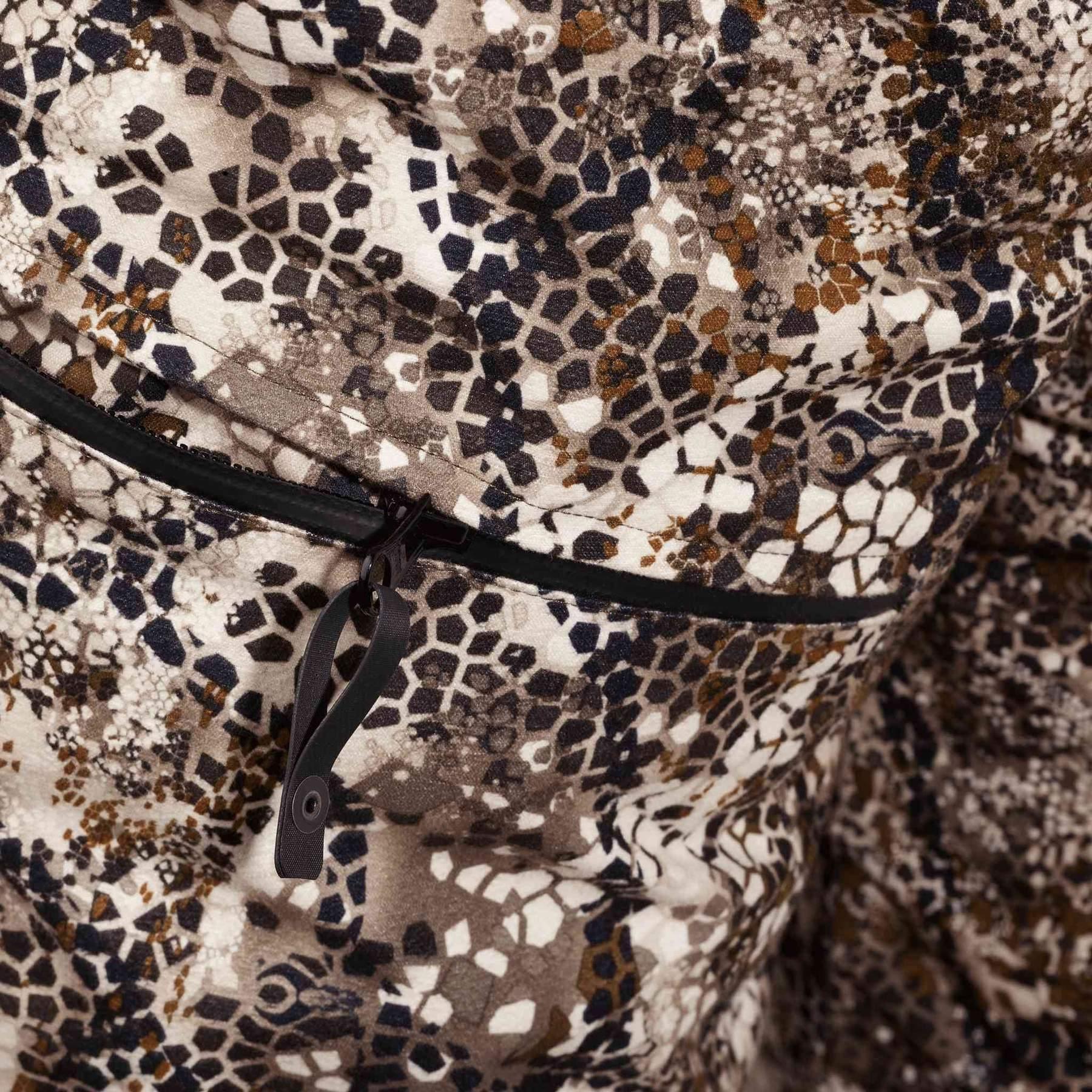 Close-up of Badlands Pyre Bib camouflage fabric with pocket zipper detail