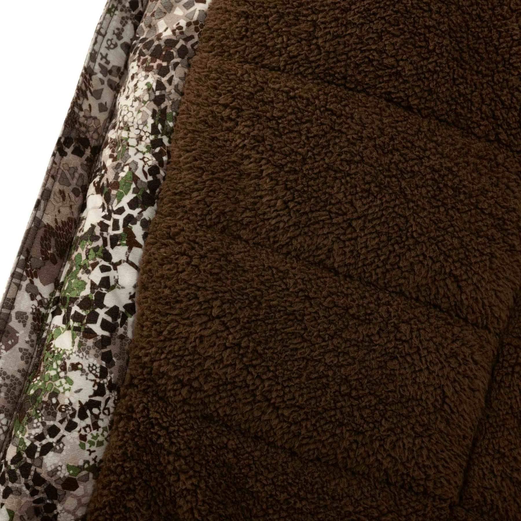Brown fleece lining and camo patterned fabric of Badlands Pyre jacket close-up