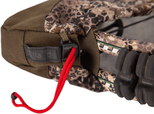 Badlands UL bow sling with camouflage fabric and red drawstring for archery gear protection