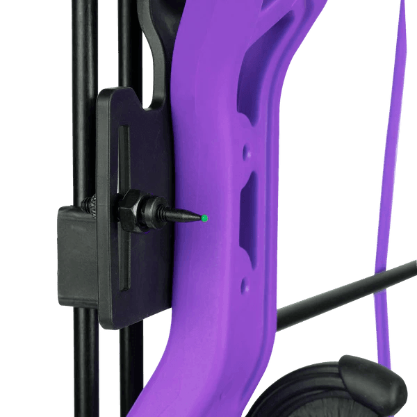 Close-up of Bear Archery Brave RH youth bow in purple with sight and cable, outdoors.