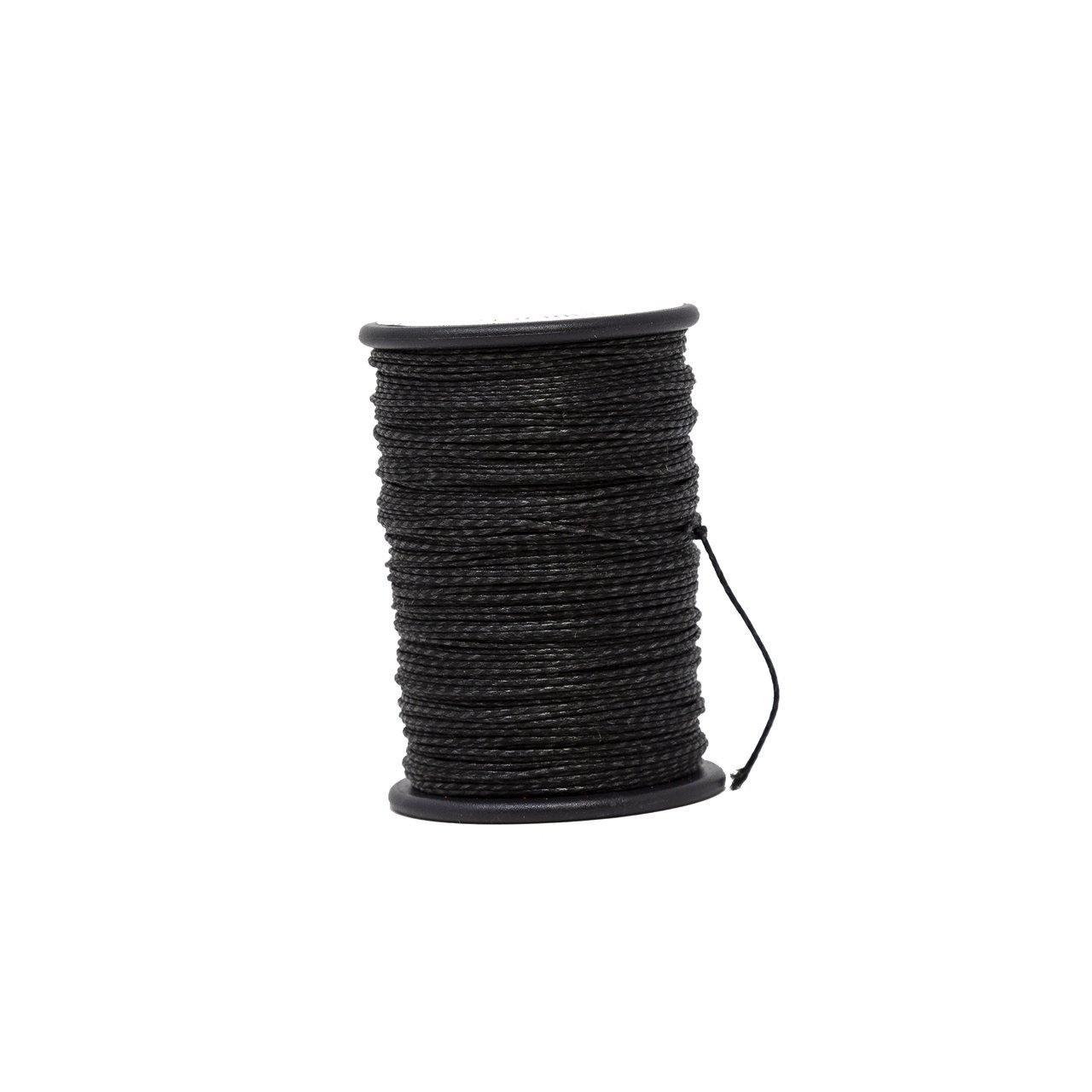 Black archery serving thread spool for bowstring maintenance on white background