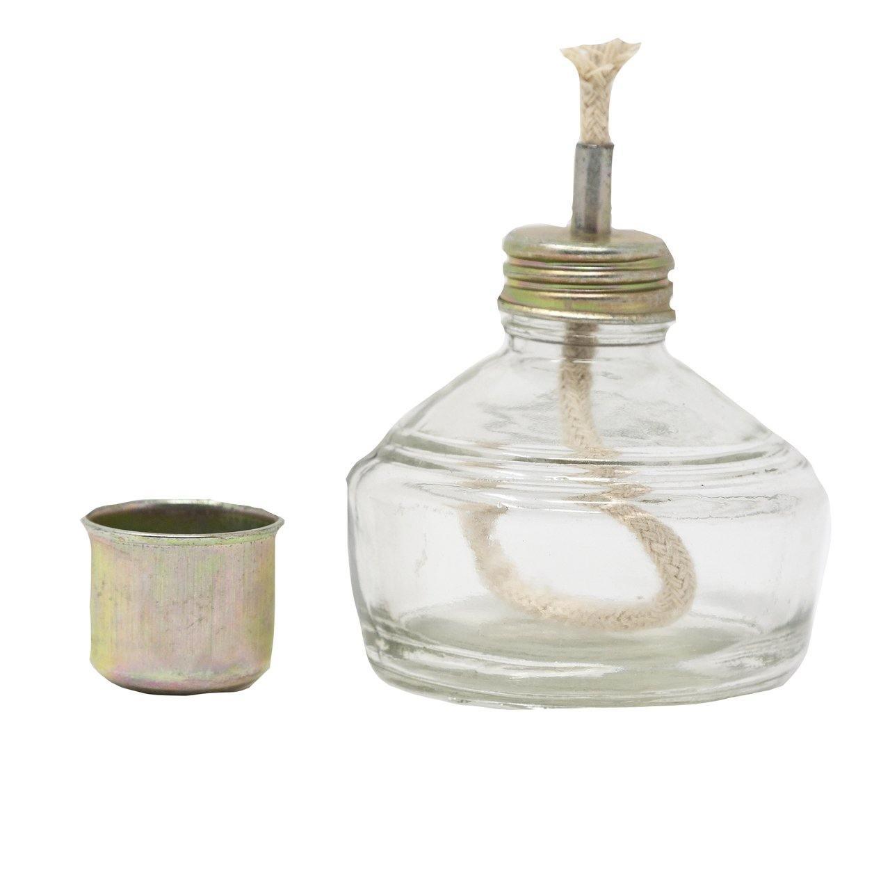Clear glass alcohol burner with metal cap and exposed cotton wick for archery use