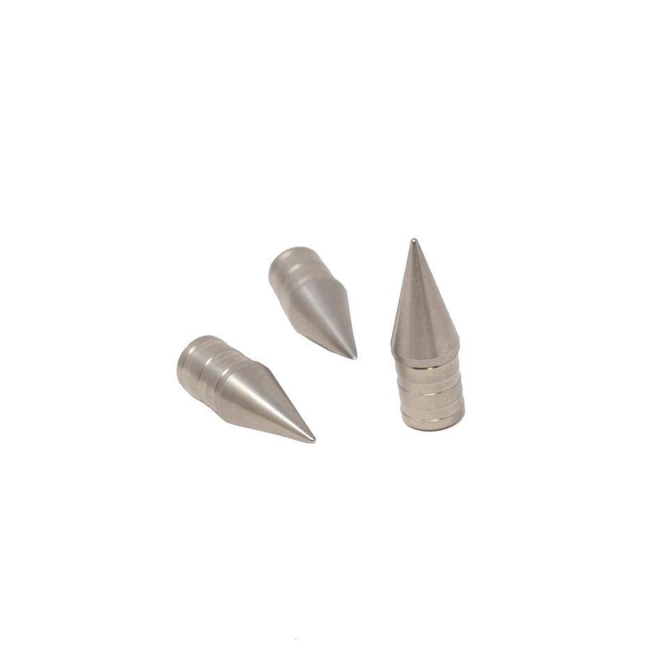 Three metallic Bohning archery pin points on white background for arrow tips