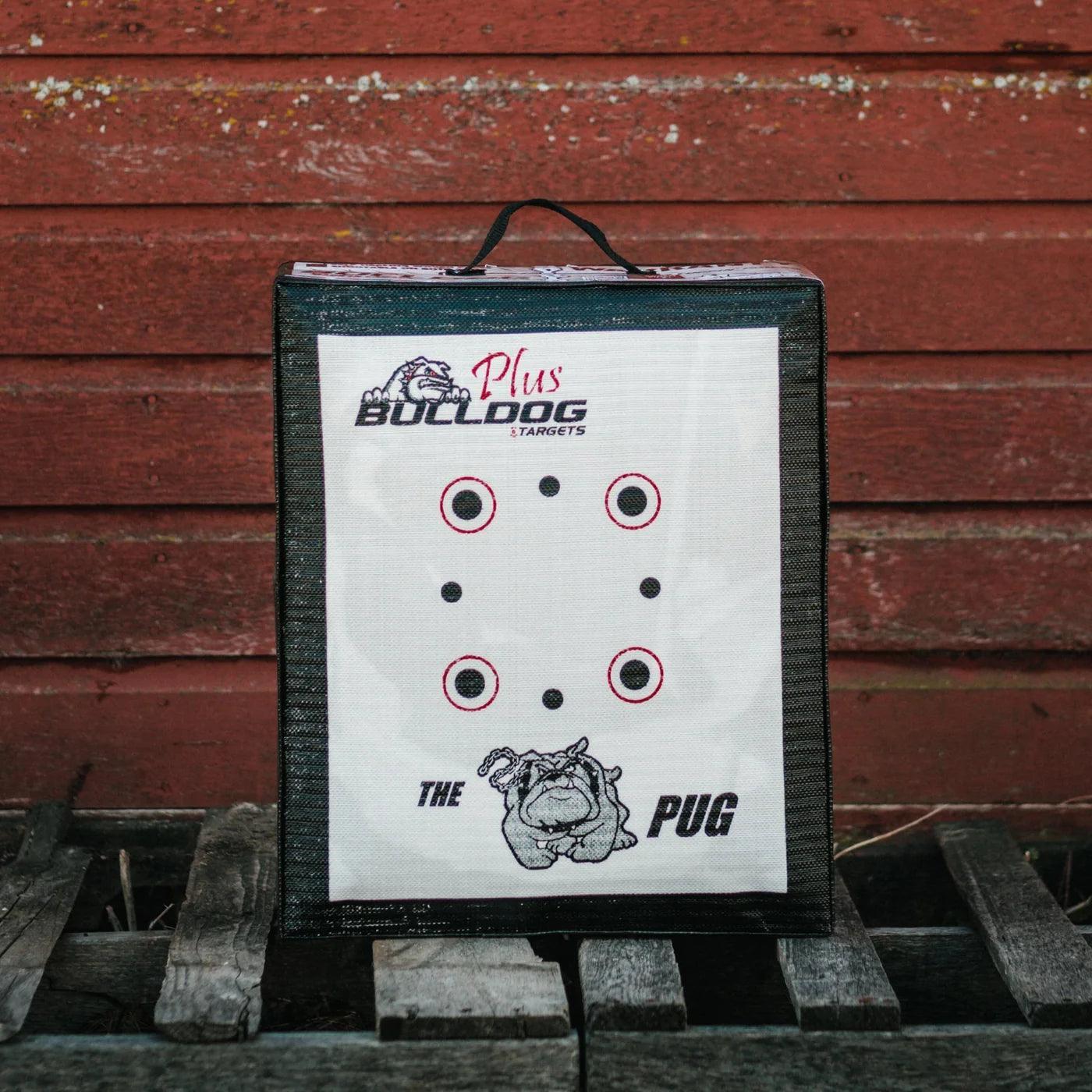 Bulldog archery doghouse pug target on wooden pallet with red wooden wall background.