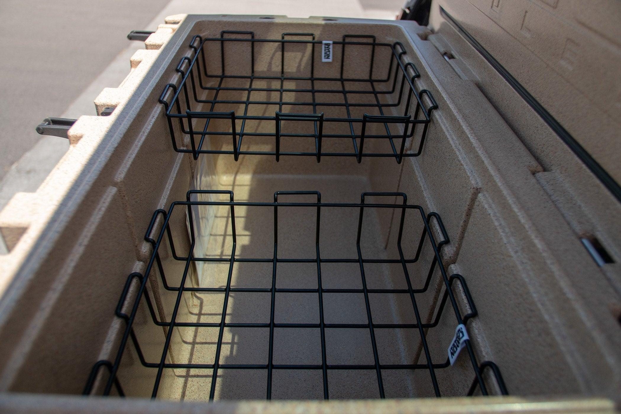 Canyon cooler baskets inside tan hard-sided cooler for outdoor storage and organization