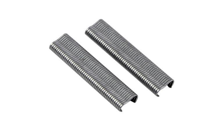 Two stacks of silver Chard hog rings on white background for outdoor sports and apparel