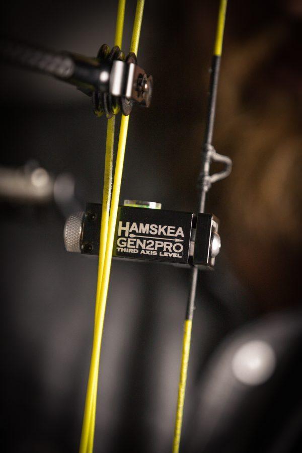 Hamskea GEN2PRO third axis level attached to a compound bow with yellow strings