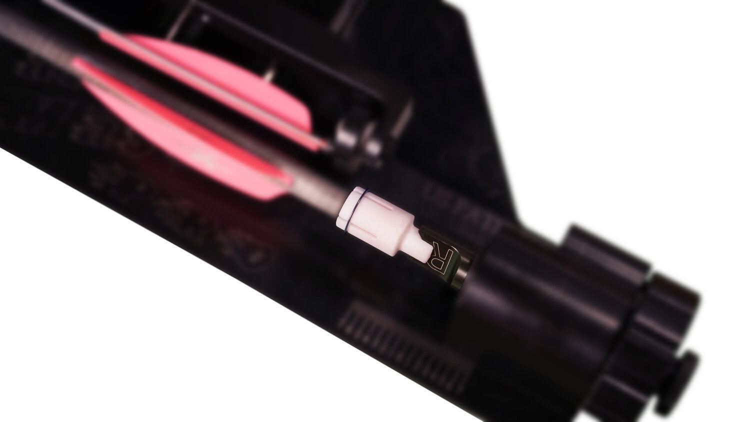Last Chance Archery Xbow Fletching Adapter with arrow and pink vanes on a jig