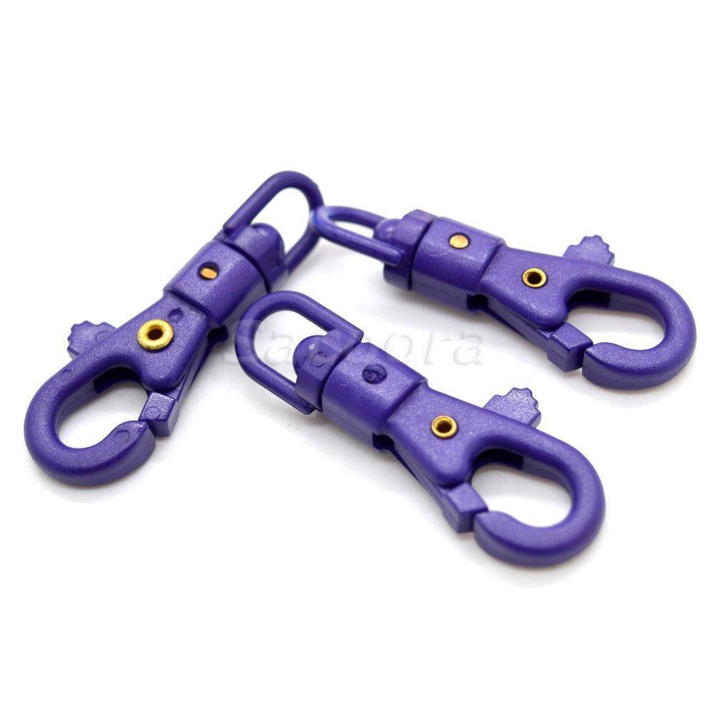 Purple paracord plastic swivel snap hooks on white background, outdoor gear hardware