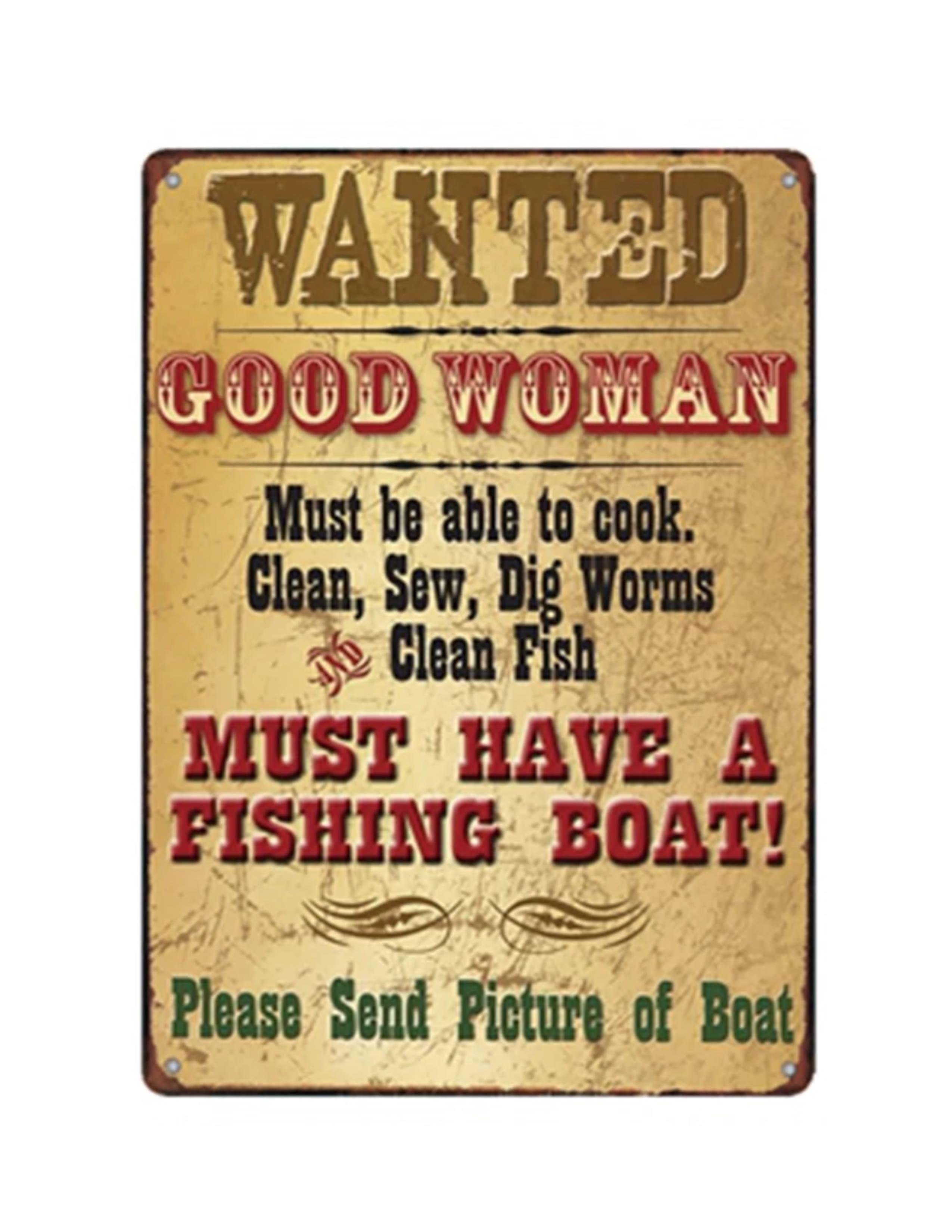 Vintage metal tin sign with distressed look reads 'Wanted Good Woman, Must Have a Fishing Boat'.