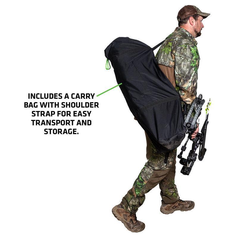 Hunter in camouflage carries bow and Primos Hidesight hunting blind in shoulder bag