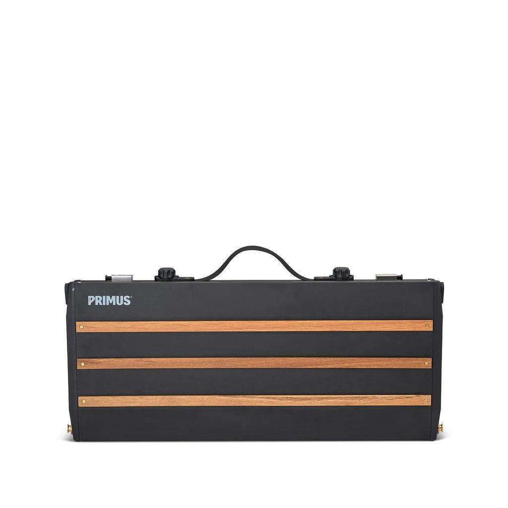 Primus Alika portable camping stove with wood accents, closed and shown on white background