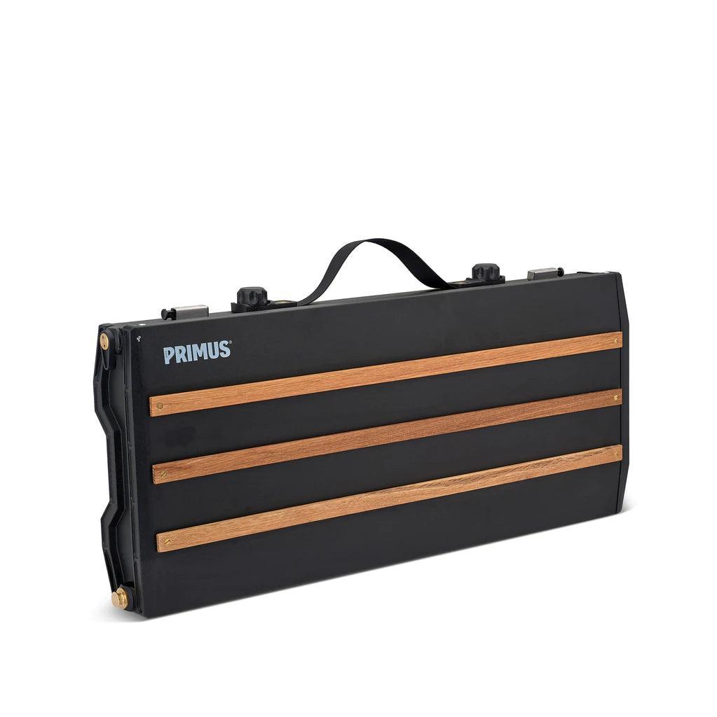 Primus Alika portable camping stove closed, black case with wood accents and handle