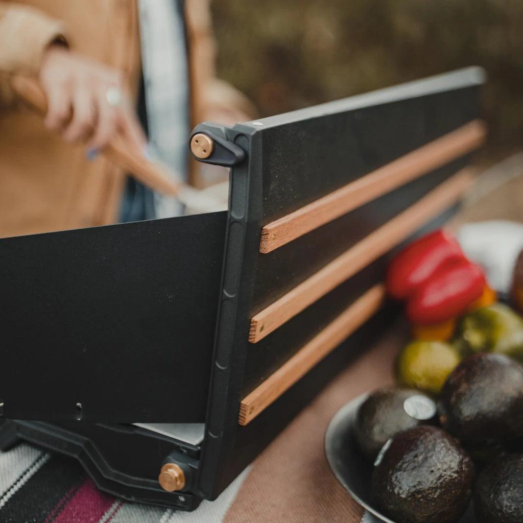 Primus Alika camp stove outdoors with fresh avocados and bell pepper on a table