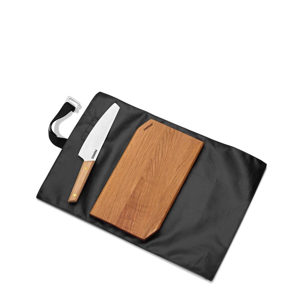 Primus campfire cutting set with wooden knife and cutting board on black carrying mat