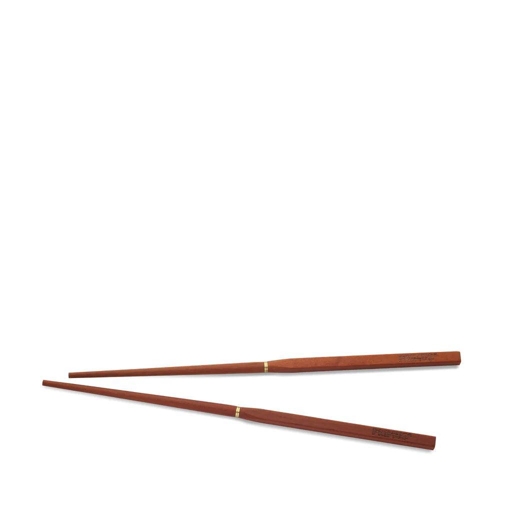 Primus wooden campsite chopsticks with gold accents on white background
