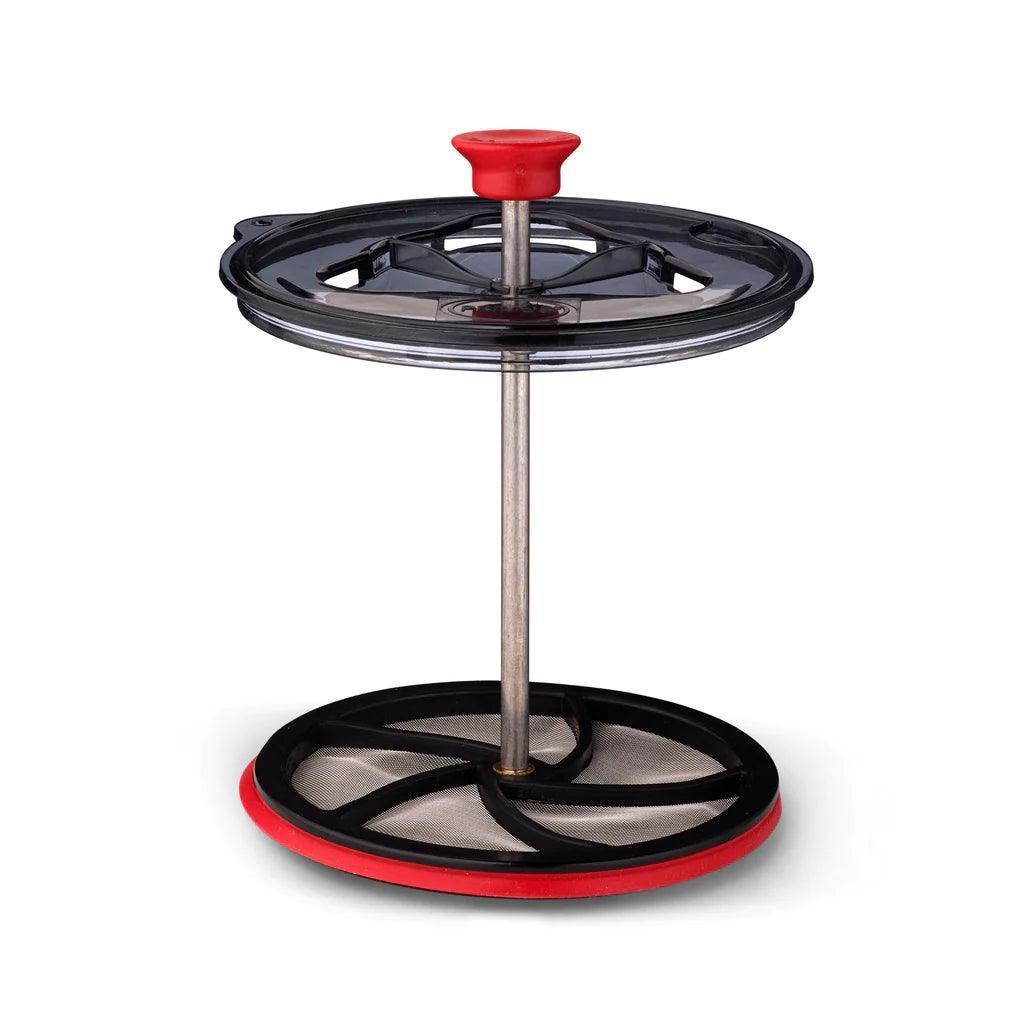 Primus campsite coffee tea press with red handle and black mesh filter for outdoor brewing