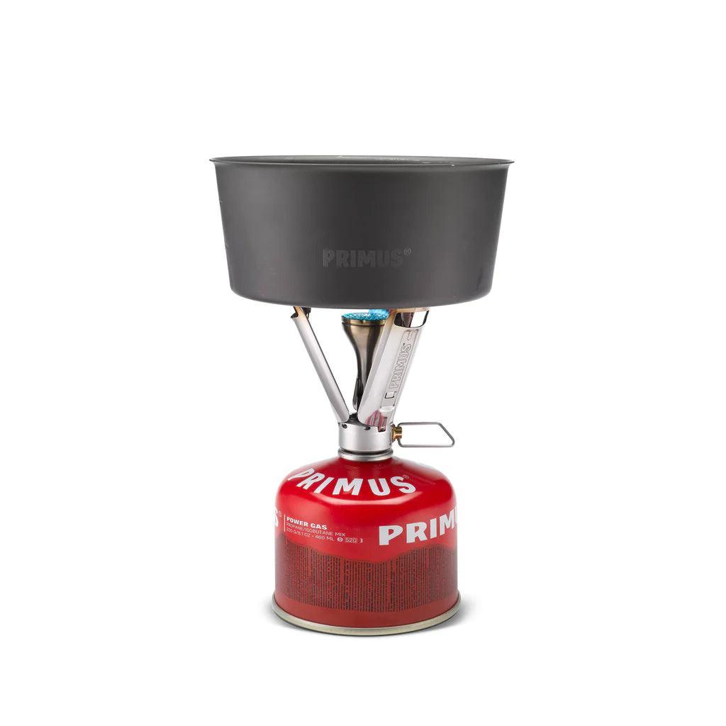 Primus Firestick backpacking stove with pot on red gas canister