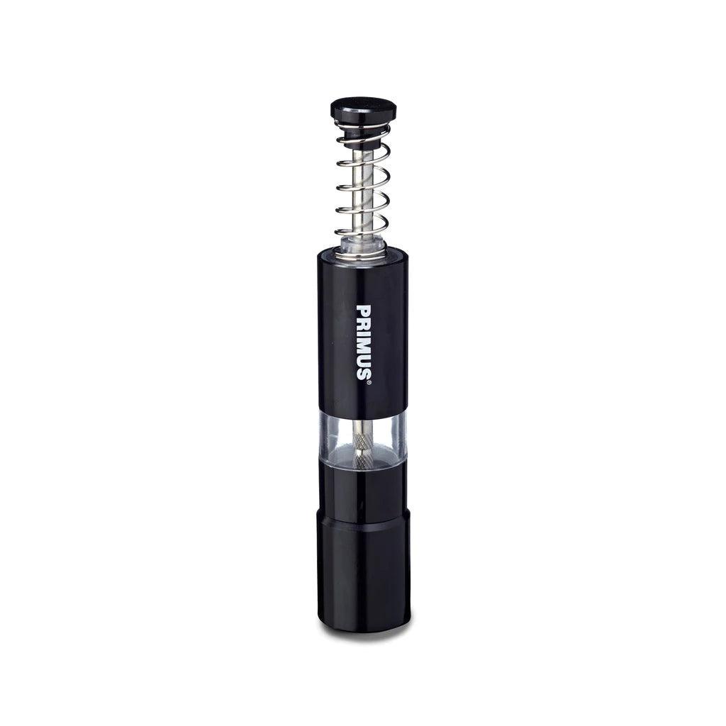 Primus campsite salt and pepper mill with black body and visible metal spring mechanism