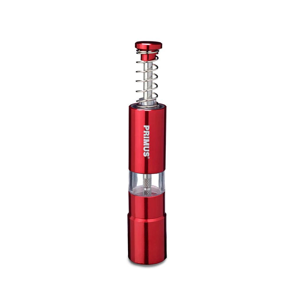 Primus red campsite salt and pepper mill with clear midsection on white background