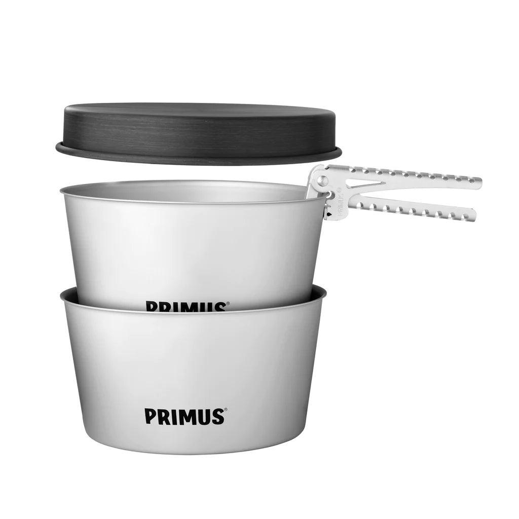 Primus Essential pot set with two silver camping pots, black lid, and metal handle