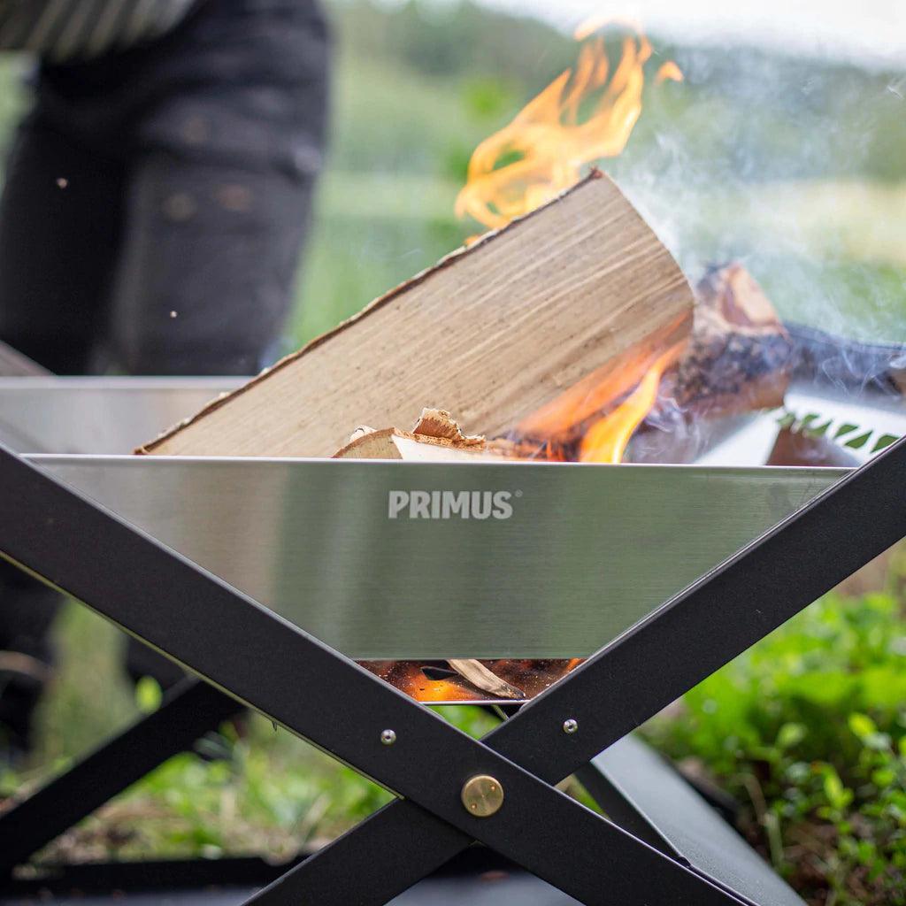 Primus Kamoto open fire pit with burning wood outdoors