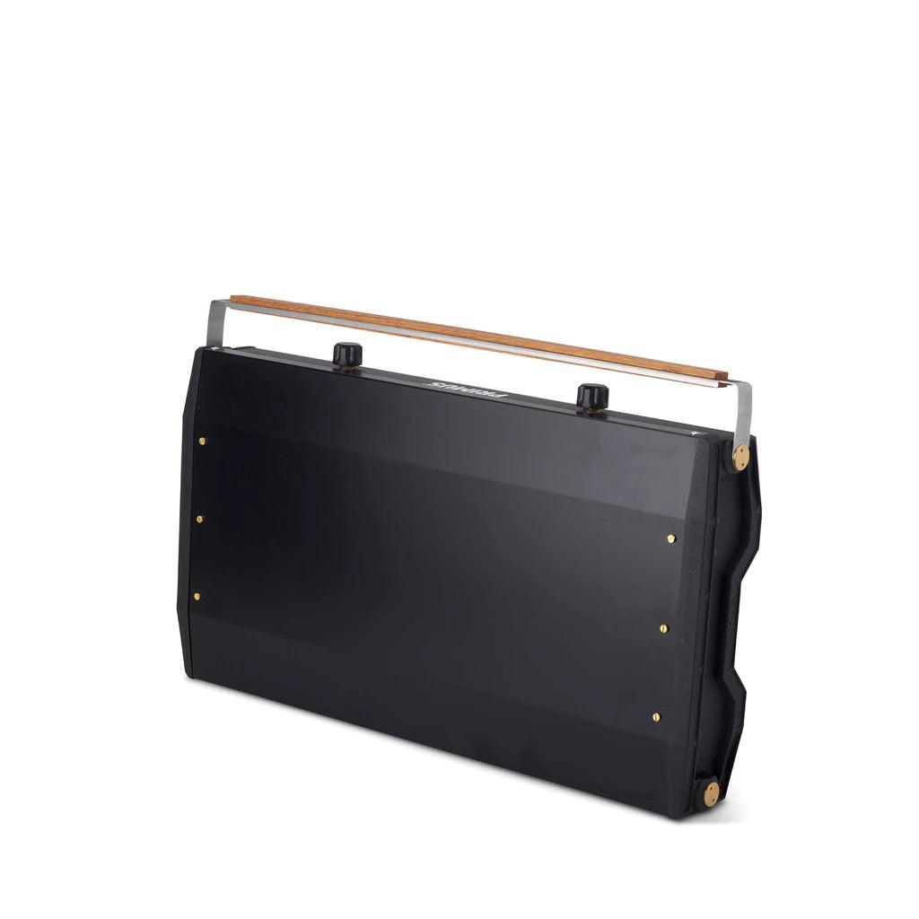 Primus Kinjia portable camping stove closed, black body with wood handle on white background