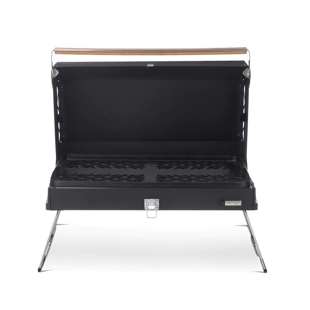 Primus Kuchoma portable gas camp grill with open lid and metal legs, front view