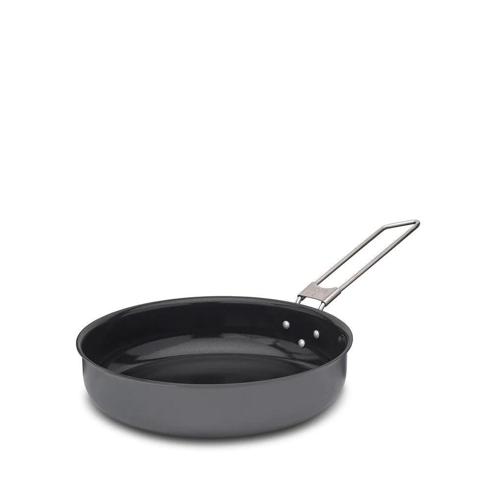 Lightweight Primus LiTech frying pan with folding metal handle on white background