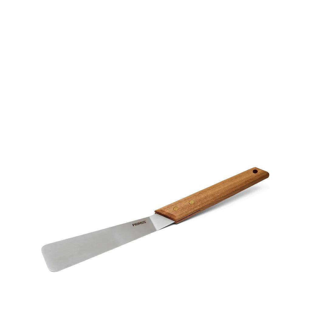Primus OpenFire spatula with stainless steel blade and wooden handle on white background