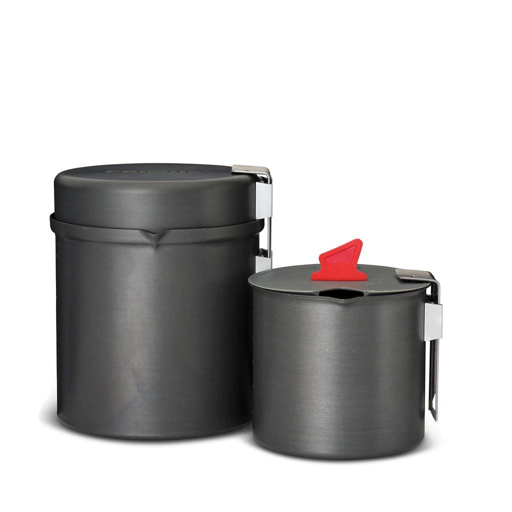 Primus Trek Pots lightweight camping cookware set with metal handles and red lid tab