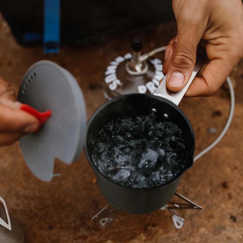 Boiling water in a Primus Trek camping pot on a portable outdoor stove